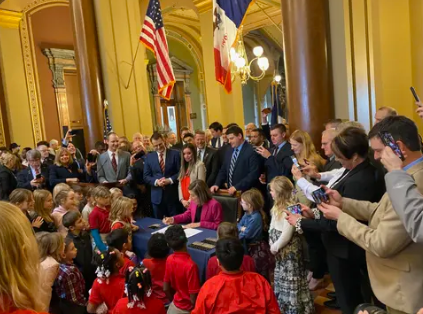 Tax dollars headed to private schools in Iowa as governor signs controversial bill